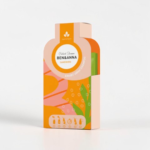 Ben&Anna Sanddorn Shampoo Flocken in einer Schüssel, natürliche Haarpflege mit Sanddorn-Extrakten, cremige Textur.