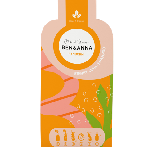 Natürliche Sanddorn-Shampoo-Flocken von BEN&ANNA in einer offenen Verpackung, ideal für die Haarpflege.